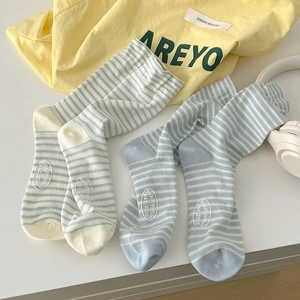 Striped knit cotton crew socks in cream, blue, and yellow stripes, stylish mid-calf length