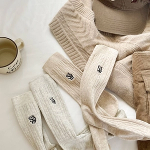 Classic crew length cotton knit socks with letter embroidery in neutral beige and grey
