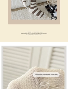 Detail of striped cotton socks showing cute dog embroidery and hand-stitched toe quality