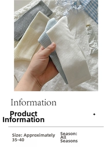 Close-up of ribbed knit crew socks in grey, cream, blue and white for sizes 35-40