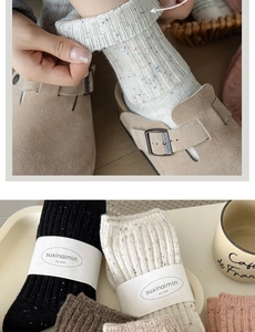 Detail of colorful nep yarn wool socks with elastic rib cuffs and minimalist packaging