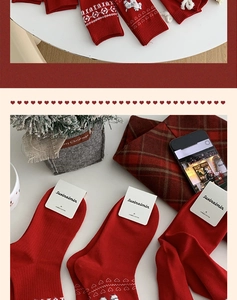 Detailed close-up of red combed cotton socks with heart jacquard and ribbed cuffs