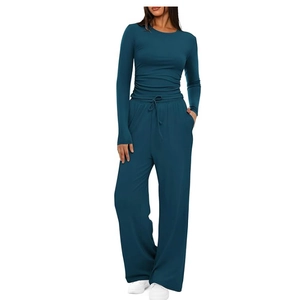 Close-up of dark teal two-piece lounge set with drawstring high-waist wide-leg pants