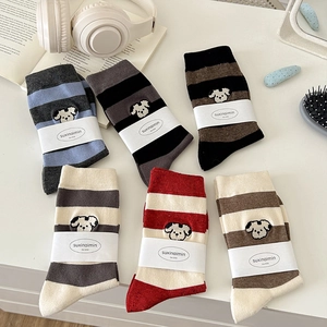 6-pack cotton blend crew socks with stripe patterns and cute dog embroidery on white desk