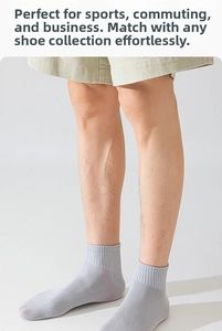 Detail of light grey ribbed cotton socks with elastic cuffs for sport and business wear