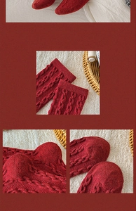 Detail of red cable knit wool socks featuring classic twist patterns and ribbed cuffs