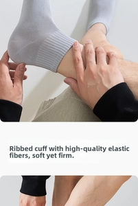 Detail of high-elasticity ribbed cuffs on grey cotton socks with resilient fiber
