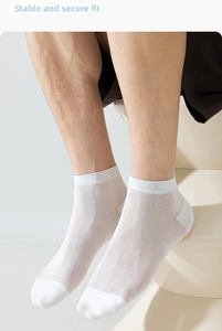 Close-up of white summer silk blend socks featuring a ribbed non-slip cuff and reinforced heel