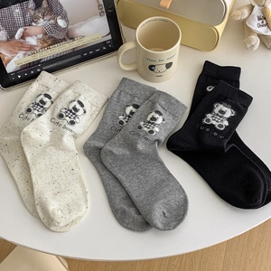 Three pairs of cute bear stripe socks in cream, grey and black colors for women