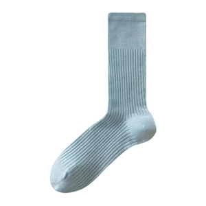 Light blue ribbed knit crew socks with vertical texture and minimalist elastic cuffs