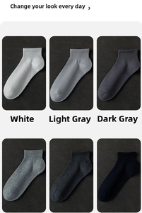 Detail of six pairs of men's cotton ankle socks in white and various grey shades