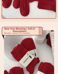 Detail of red Year of the Snake socks with diamond jacquard and embroidery texture