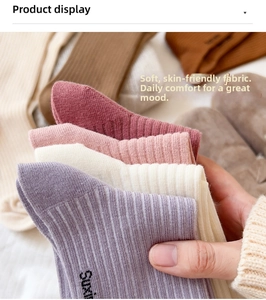 Detailed view of colorful ribbed knit cotton socks showing soft texture and logo detail