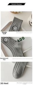 Detail of gray ribbed crew socks showing elastic cuff, reinforced toe and 3D heel structure