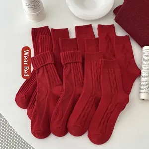 Red cotton knit crew socks with vintage diamond patterns and cables for Chinese New Year