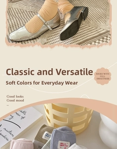 Detailed close-up of ribbed cotton socks with Hello Nice Day labels in pastel colors