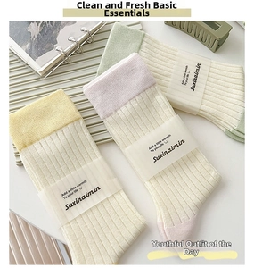 Three-pack of ribbed cotton crew socks in pastel yellow, pink, and light green shades