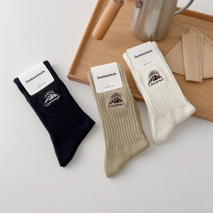 Three-pack of combed cotton crew socks with outdoor camping mountain embroidery