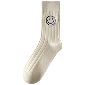 Creamy white ribbed mid-calf socks with cute black smiley face embroidery for women