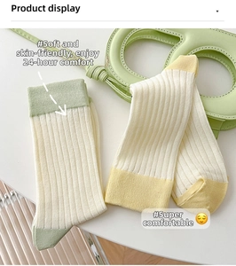 Detail of soft ribbed knit cotton crew socks with colorful contrast heel and toe