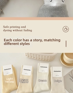 Detail of soft pastel combed cotton socks with vertical ribbed texture in assorted colors