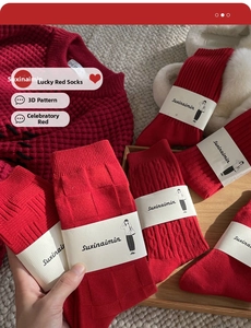 Macro shot of red cotton socks with waffled, twisted and ribbed knit patterns for Chinese New Year