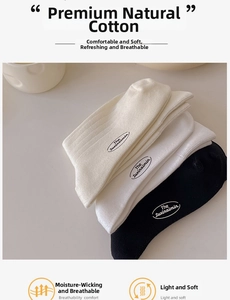 Detail of cotton crew socks in black and white with side logo print for daily wear