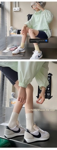 Detailed view of ribbed cotton mid-calf socks paired with stylish contrast sports sneakers