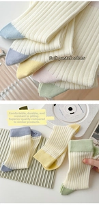Detailed view of ribbed cotton mid-calf socks with pastel color blocking and soft texture
