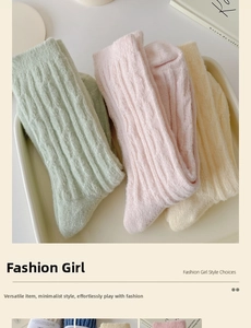 Close-up of thick knitted cable socks in pastel mint, pink, and yellow for autumn