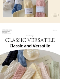 Detail of cable knit crew socks in macaron colors displayed with cozy lifestyle props