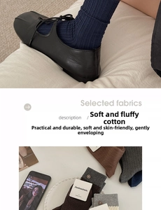 Detail of combed cotton mid-calf socks with decorative buttons and ribbed texture