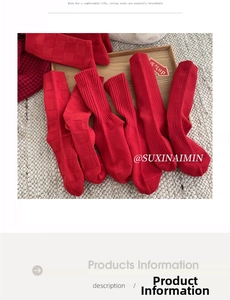 Festive red combed cotton socks with checkerboard and striped patterns on a wooden tray