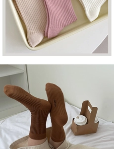 Detailed knit ribbed texture of cotton mid-calf socks in various neutral aesthetic colors