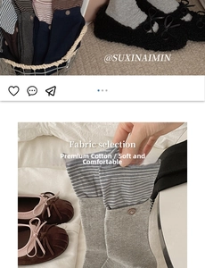 Detail of striped cotton socks paired with bow ballet flats in a cozy home setting