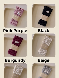Detailed grid view of six-color ribbed cotton socks with ruffled edges and branded labels