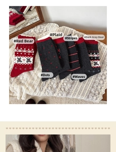 Detail of grey and red knit socks with bear patterns, polka dots and striped textures