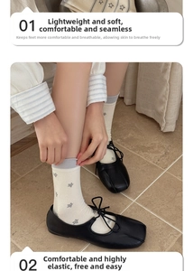 Detail of cream calf socks with star pattern paired with black Mary Jane shoes