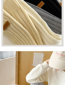 Close-up of thick knit cotton socks with brown leather label and stylish texture detail