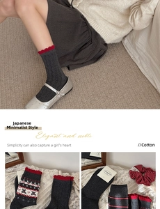 Detail view of gray cotton socks with red ruffle trim, bear patterns and stripe motifs