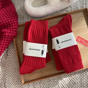 Festive red crew socks set with ribbed and checkered patterns for the Lunar New Year