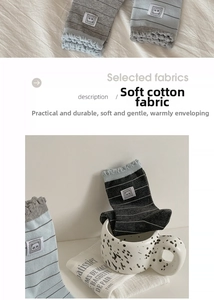 Close-up of cotton socks with panda label, stripe patterns, and lettuce trim cuff