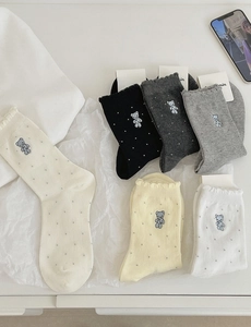 Detail of 6-pack cotton socks featuring cute bear embroidery and ruffled lettuce trim edges