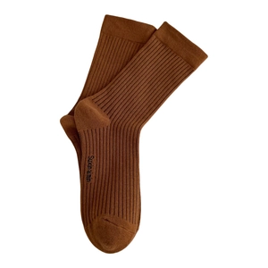 Deep brown ribbed cotton crew socks featuring side brand text laid on white backdrop