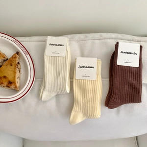 Three pairs of Japanese style combed cotton ribbed crew socks in white, beige, and coffee
