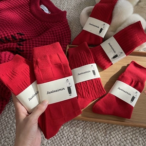 Festive red crew socks for women featuring classic cable knit and checkered textures