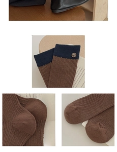 Detail view of vintage brown knit sock featuring blue trim and a textured metal button