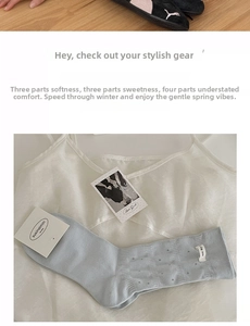 Close-up of light blue cotton socks featuring polka dot jacquard and I dig you woven label