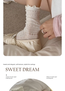 Detail of lace hollow-out mesh socks with ruffled edge and vintage floral knit patterns