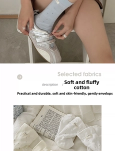 Detailed view of polka dot cotton socks with 'i dig you' label and soft cotton texture